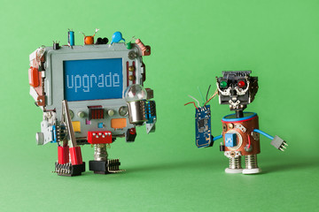 Upgrade computer concept. Handyman technician robot with circuit in hand and monitor computer...