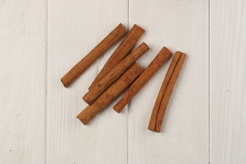 Cinnamon on the table. Close up. White background