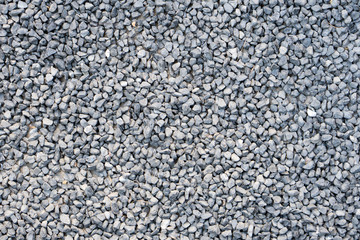 Ground stone, grey, background of many small stones.