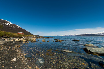 Fototapeta na wymiar Coast of the Norwegian Sea.Tromso,Oldervik.