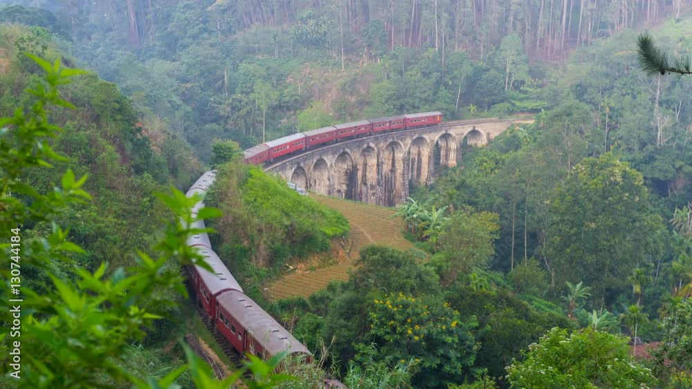 Sticker The early morning on the mountain slope with a view on the train, running along the Nine Arches Bridge, Demodara, Ella, Sri Lanka.
