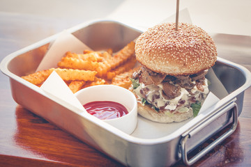 Home made hamburger with lettuce and cheese.