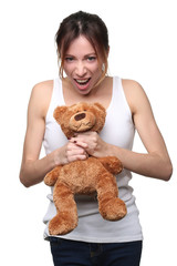 Woman choking teddy. Close up. White background