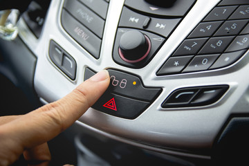 Obraz premium finger press and hit the lock doors car button and show status l