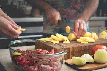 Cooking baked meat with potatoes  and vegetable horizontal