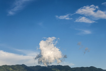 clouds, sunny day, sunshine, blue skies and mountain in Guatemala.