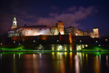 Night view of Wawel castle located at Vistula river in Cracow. P