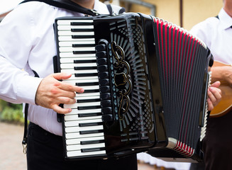 Hand playing accordion closeup