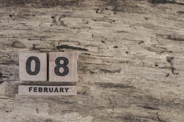 cube calendar for february on wooden background