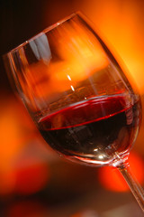 Glass of wine beside the fire