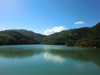Beautiful placid lake with forest in Hong Kong park