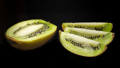 kiwi on a black background, for advertising or other purposes.   