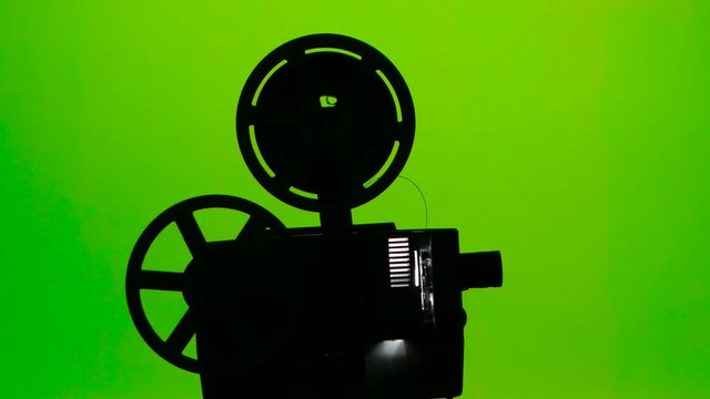 Moving parts of a film projector. Green screen