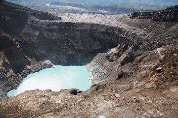 A volkanic lake in the crater. Volcano Gorely, Kamchatka, Russia