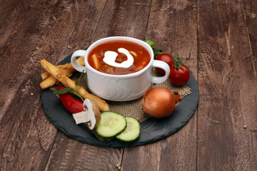 fresh tomato soup in a white bowl