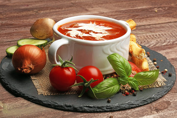 fresh tomato soup in a white bowl