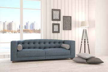 White living room interior with sofa