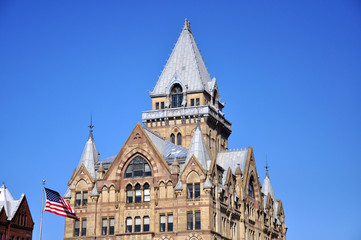 Fototapeta premium Syracuse Savings Bank Building was built in 1876 with Gothic style at Clinton Square in downtown Syracuse, New York State, USA. Now this building is a US National Register of Historic Places.