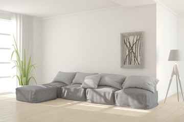 White living room interior with sofa