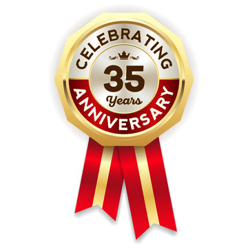 Red celebrating 35 years badge, rosette with gold border and ribbon