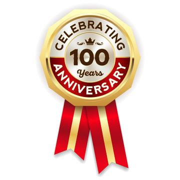 Red celebrating 100 years badge, rosette with gold border and ribbon