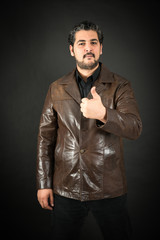 Handsome man doing different expressions in different sets of clothes: thumbs up