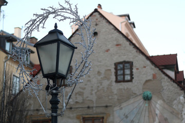 Fototapeta na wymiar Vintage lamp with Christmas decoration in Tkalciceva street - picturesque street in Zagreb, Croatia. 