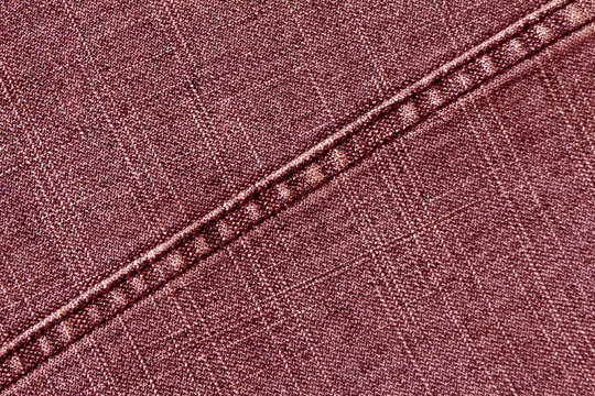 Red jeans cloth texture with stitch.