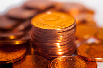 pile of coins between heap of shining coins