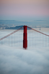 Thick fog covering Golden Gate Bridge.