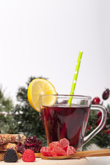 Tea with lemon and biscuits on a wooden base