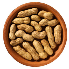 Peanuts in the shell on a saucer.