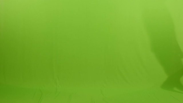 businessman walking through against green screen background.