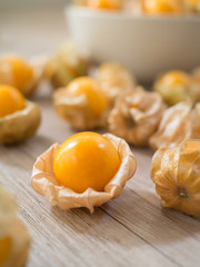 Fresh Cape gooseberry on wooden background