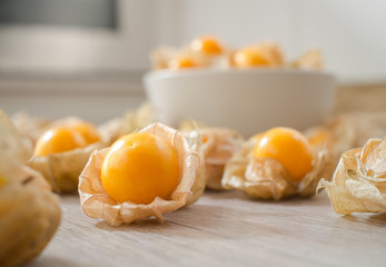 Fresh Cape gooseberry on wooden background