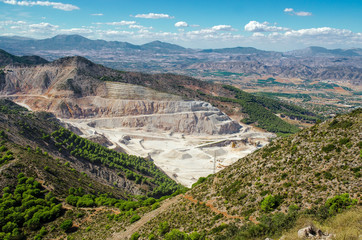 Overall view of limestone quarry near Calamorro mountain and Benalmadena town, provence Malaga, Andalusia, Southern Spain. 