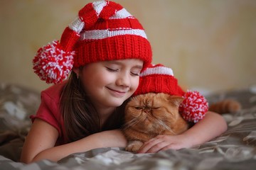 the girl with the cat in the hats Santa Claus