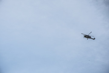 Naklejka na ściany i meble Oman dhofar region Military helicopter flying blue sky