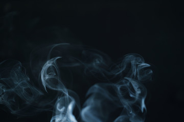 Fototapeta premium real blue smoke over black background