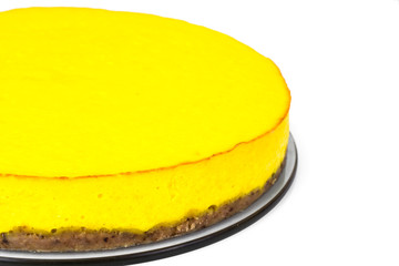 Delicious bright orange homemade american pumpkin pie on a white