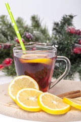 Tea with lemon and cinnamon on a wooden base