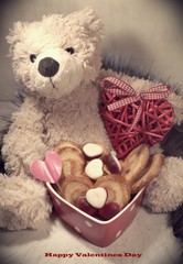 Teddy bear and sweet hearts. Teddy bear as a gift for Valentine. Happy Valentines day
