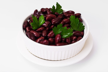 Beans, spices and curry in white salad bowl