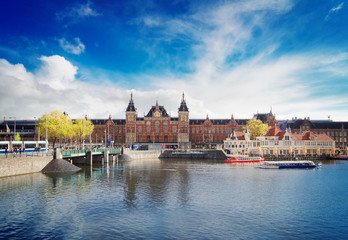 cityscape with central railway station and old town canal, Amsterdam, Holland, retro toned