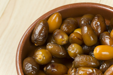 Dates in a clay pot.