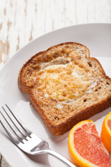 Toad in a hole egg breakfast with Cara Cara oranges macro shot