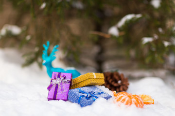 Christmas presents under the Christmas tree in the snow