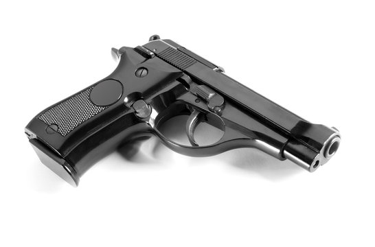Black automatic handgun on white