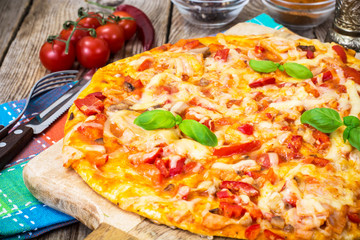 Pizza with prosciutto,mushroom and tomatoes