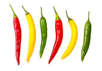 Colorful chili peppers on a white background
